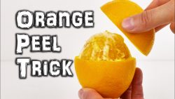 orangen schaeltrick mit der hand